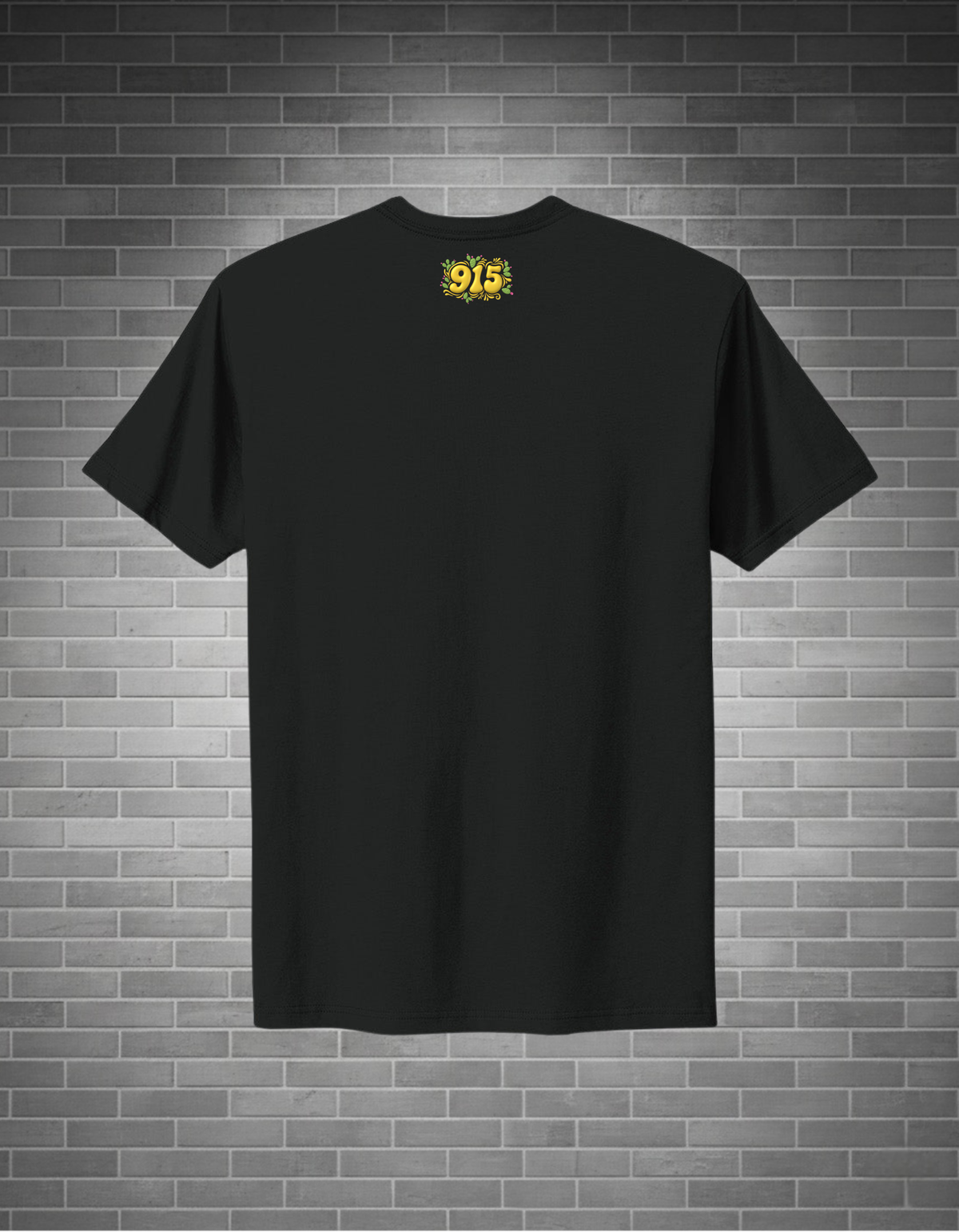 Black t-shirt with a yellow logo on the back against a brick wall background