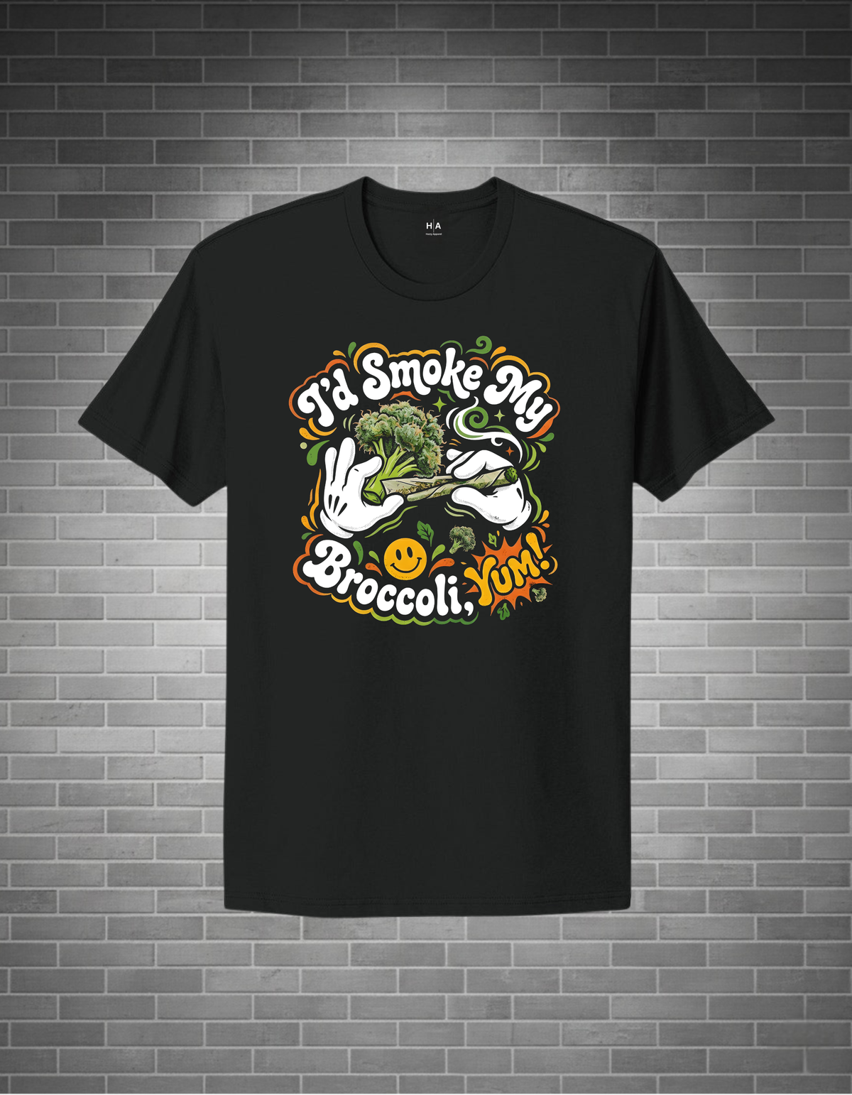 Black t-shirt with colorful graphic design on a brick wall background