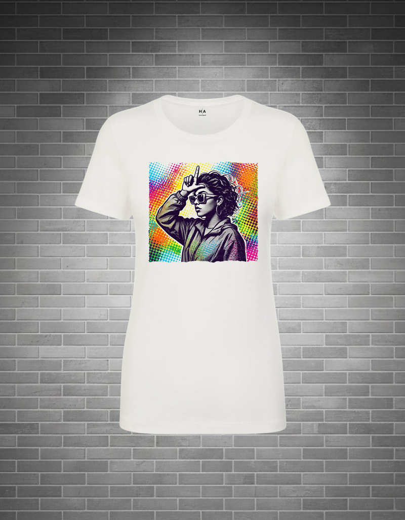 A white short-sleeve crewneck t-shirt featuring a colorful graphic print of a woman wearing sunglasses, displayed against a gray brick wall background.