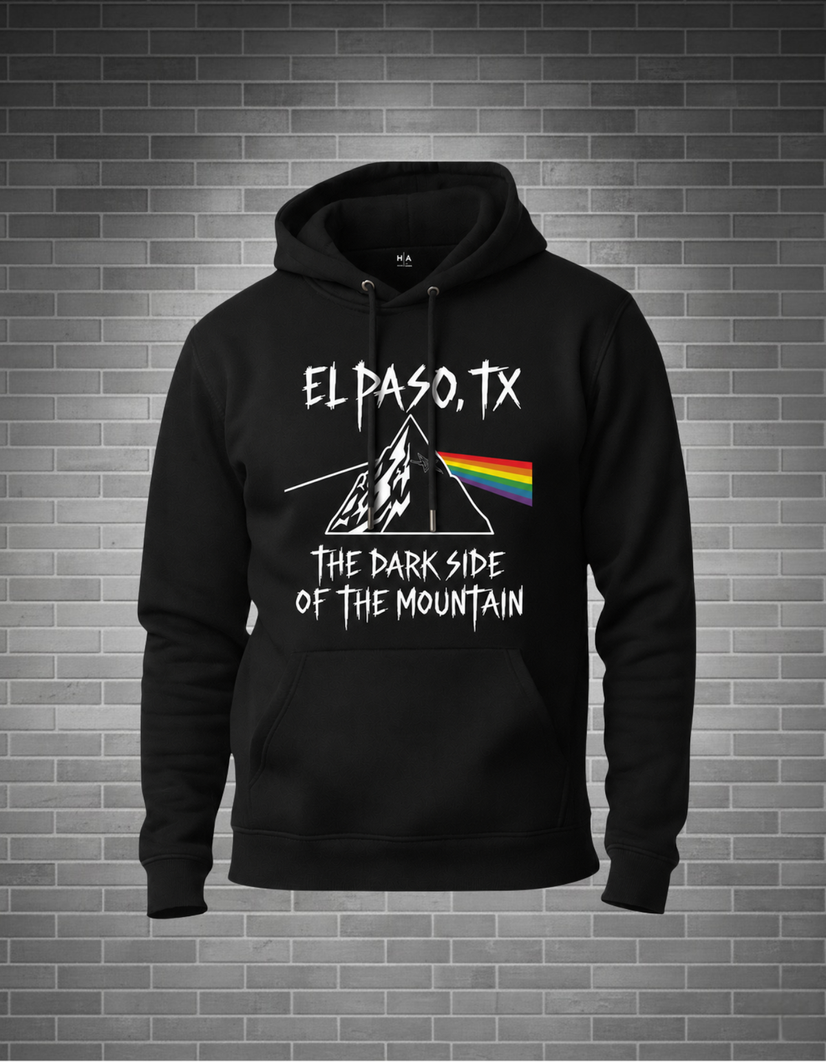 black hoodie pink floyd dark side of the moon album el paso style. grey brick background