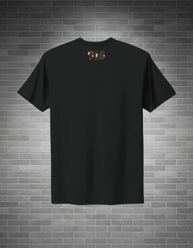 Black t-shirt with a small logo on a brick wall background