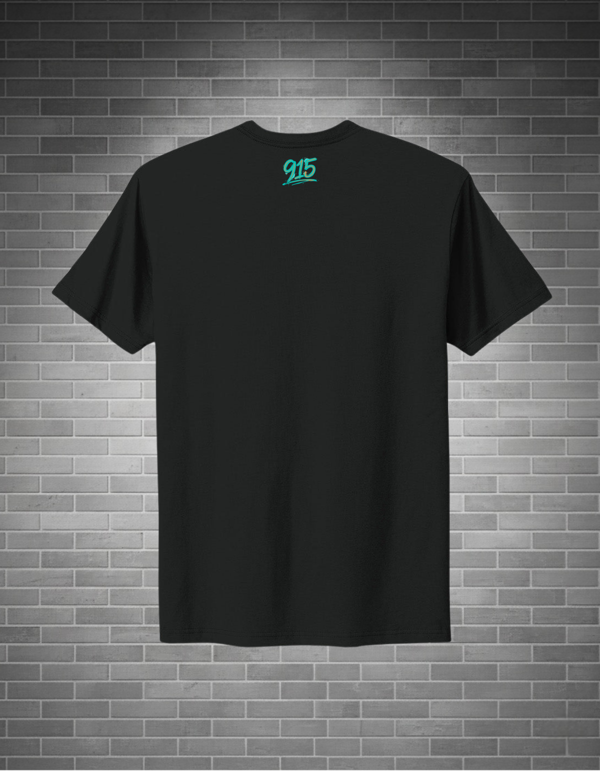 Black t-shirt with a logo on the back against a brick wall background