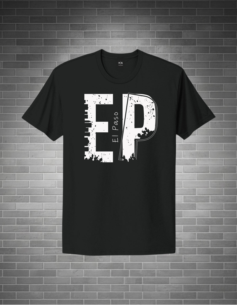 Black t-shirt with white graphic design on a brick wall background