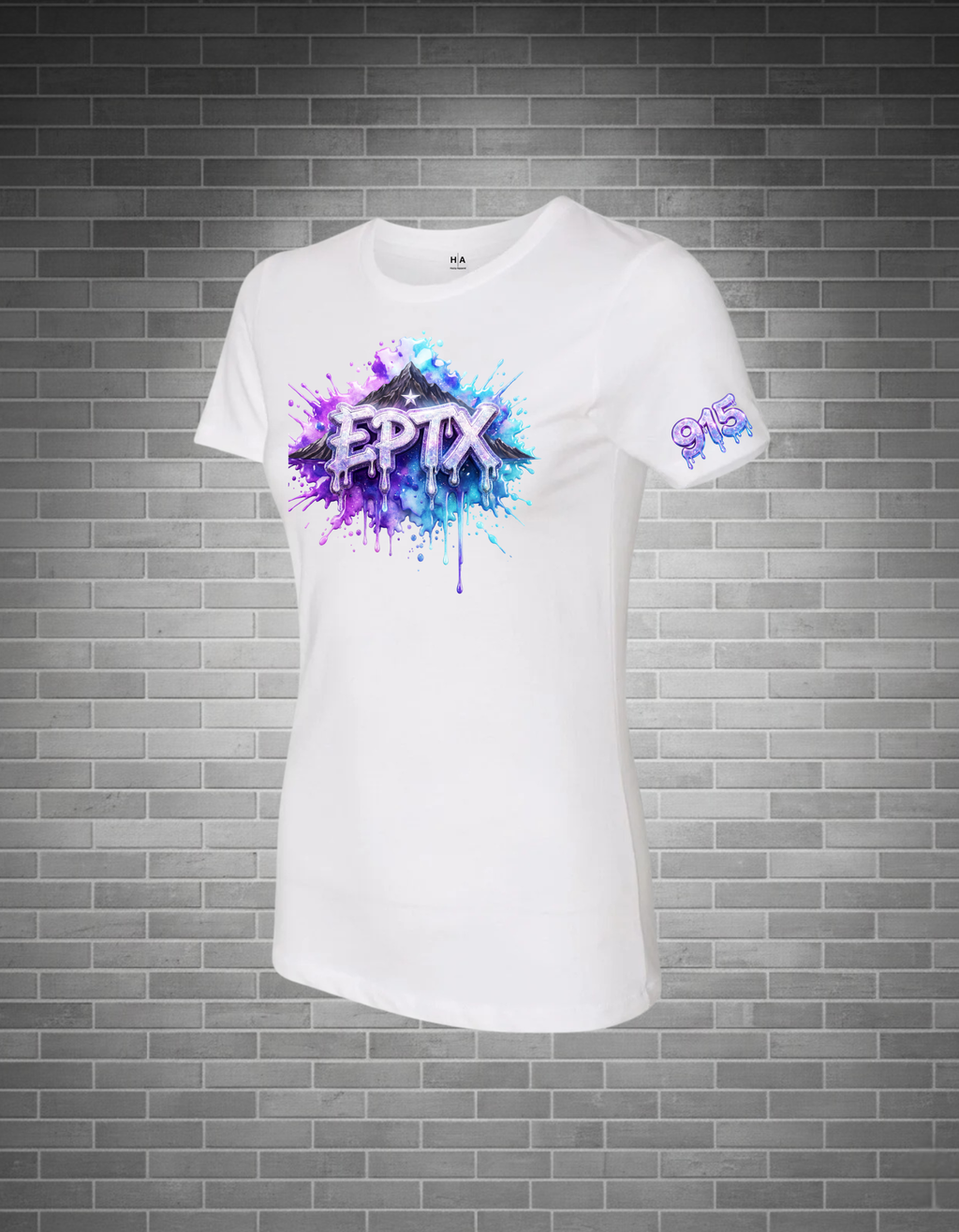 White t-shirt with colorful 'EPTX' and 915 design on a brick wall background