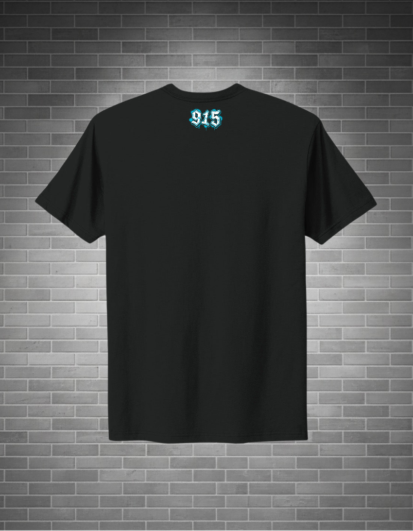 A black short-sleeve t-shirt with a small light blue gothic-style '915' graphic printed on the upper chest, displayed against a gray brick wall background.