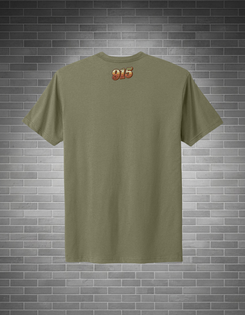 Green t-shirt with a logo on the back against a brick wall background