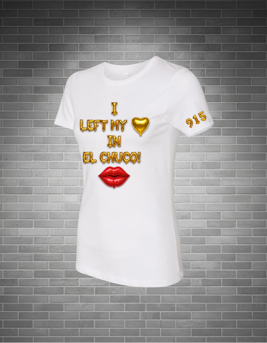 White t-shirt with colorful text and graphics on a brick wall background