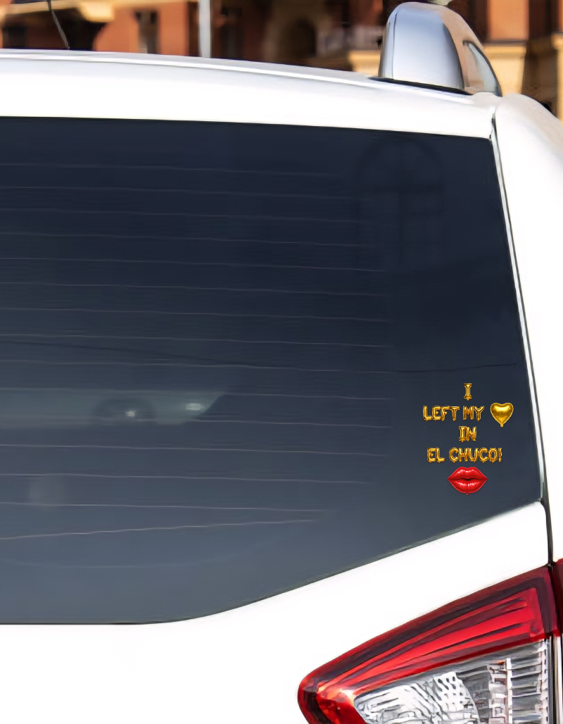 Car window with a humorous sticker on a blurred background