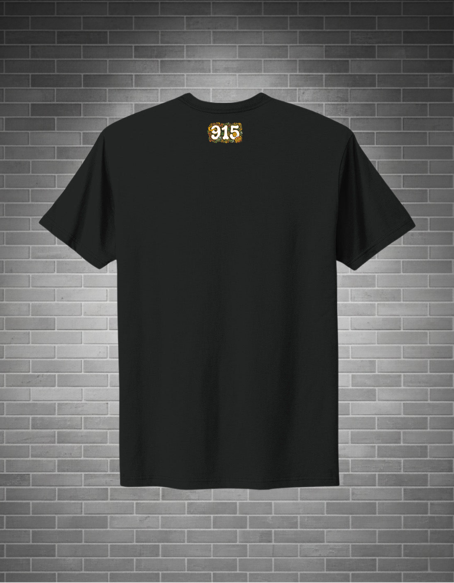 Black t-shirt with a logo on the back against a brick wall background