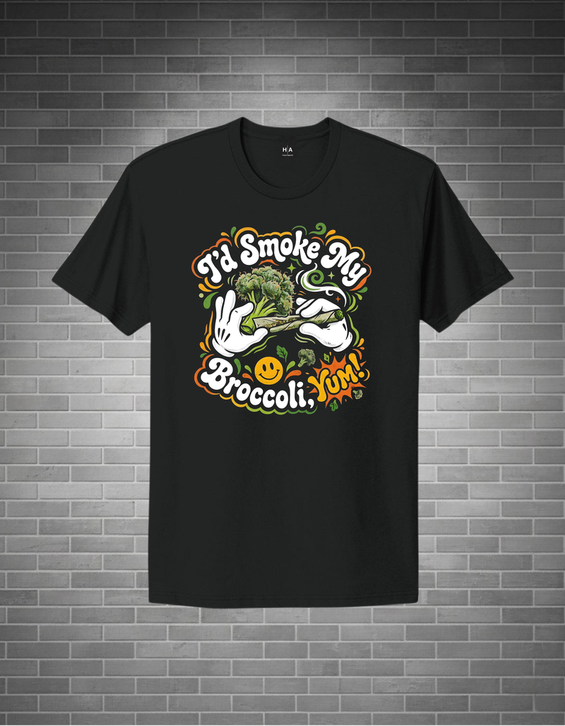 Black t-shirt with colorful graphic design on a brick wall background