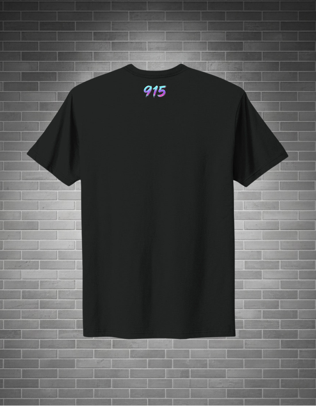 A black short-sleeve crewneck t-shirt with a small colorful '915' graphic printed on the upper chest, displayed against a gray brick wall background.