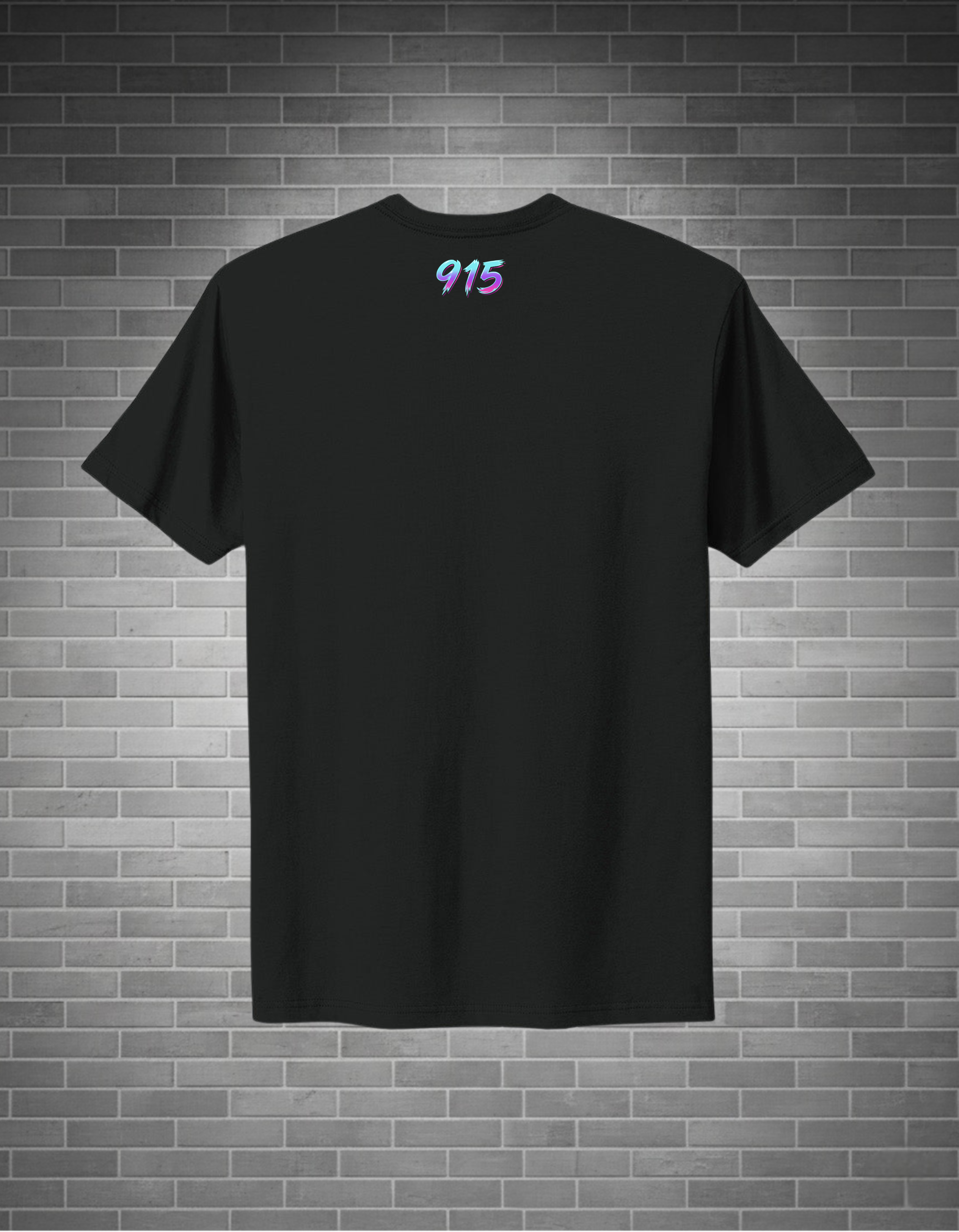 A black short-sleeve crewneck t-shirt with a small colorful '915' graphic printed on the upper chest, displayed against a gray brick wall background.