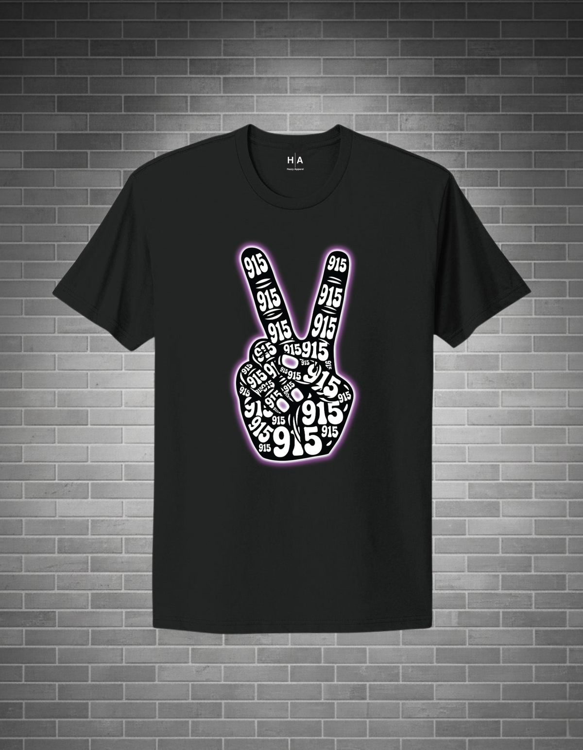 Black t-shirt with peace sign design on a brick wall background