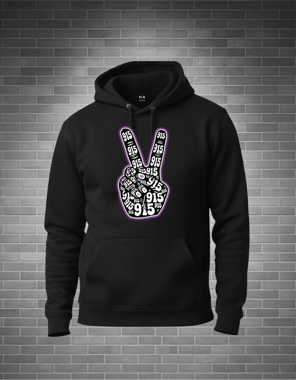 Black hoodie with peace sign design on a brick wall background