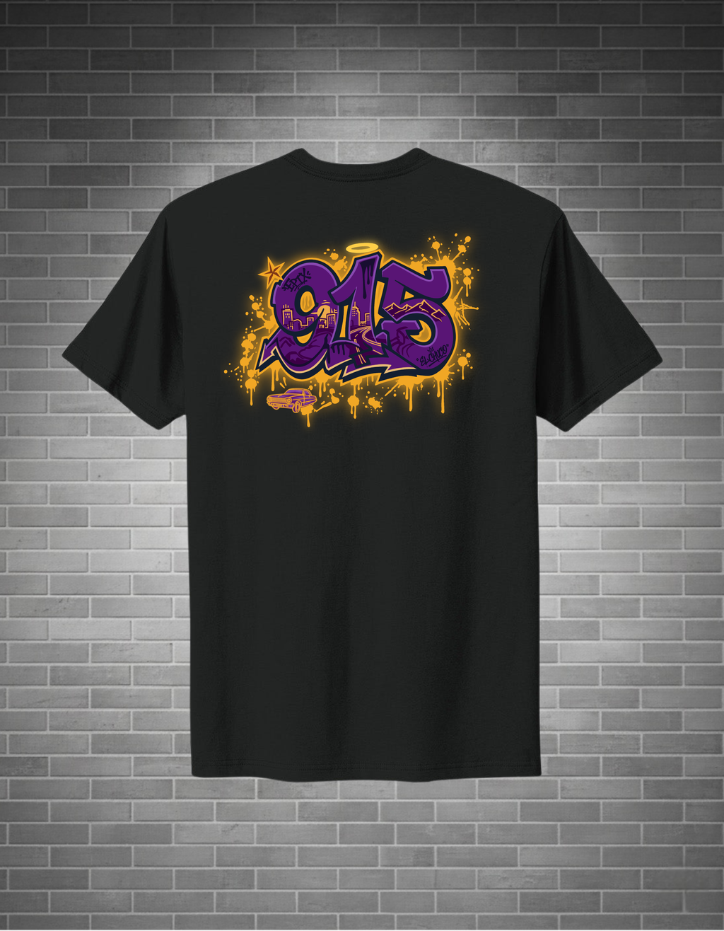 Black t-shirt with a colorful graphic design on the back against a brick wall background