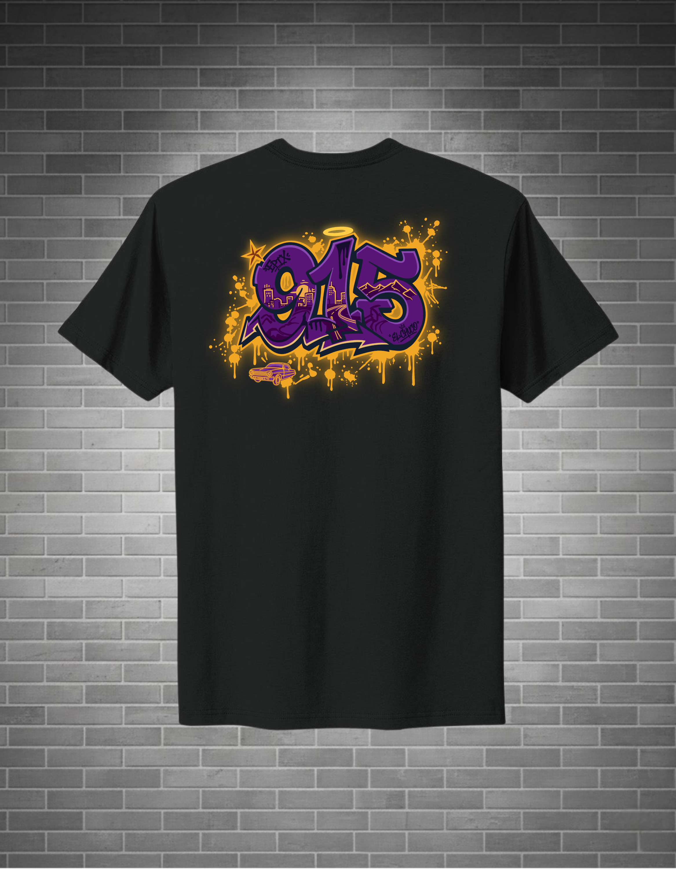 Black t-shirt with a colorful graphic design on the back against a brick wall background