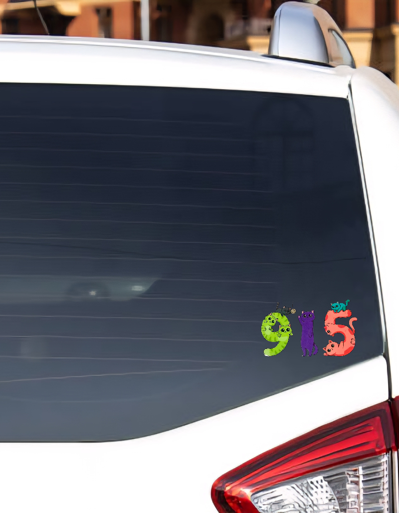 Colorful Cat 915 sticker on a car rear window