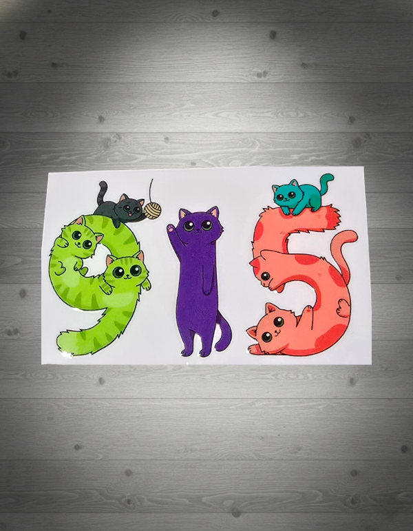 Colorful numbers 9, 1, and 5 with cat illustrations on a grey wooden background.