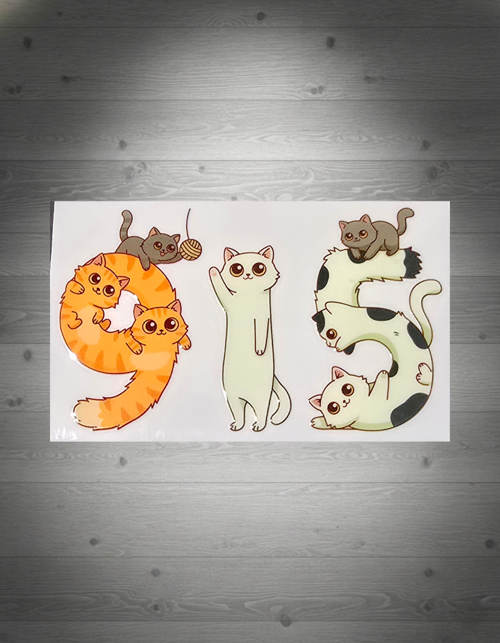 Sticker design with cartoon cats on a white background, featuring numbers 9,1, and 5.