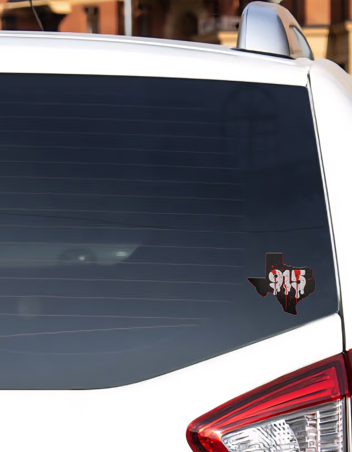 915 Texas shaped with red splatter sticker on car rear window