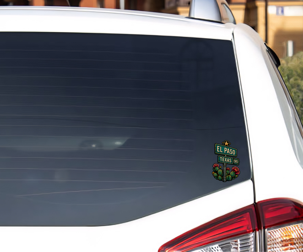 A small El Paso Texas street sign decal with red roses is shown applied to the rear window of a white vehicle.